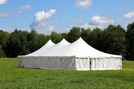 Beautifully lit outdoor tent event