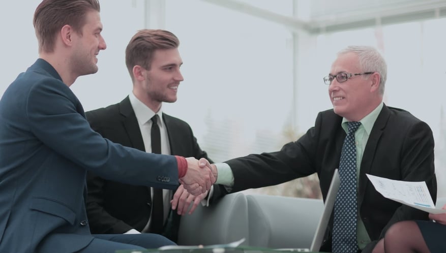 Purchase manager and employee shaking hands